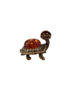 Figurine en laiton et ambre .